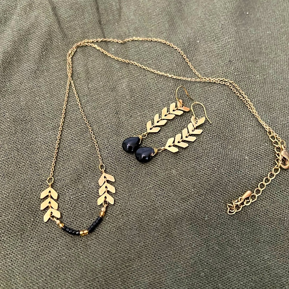 Dainty black and gold tone necklace and earring set.